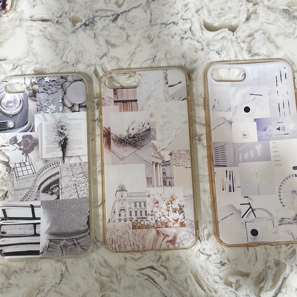 2 white iPhone cases and 1 gray iPhone case